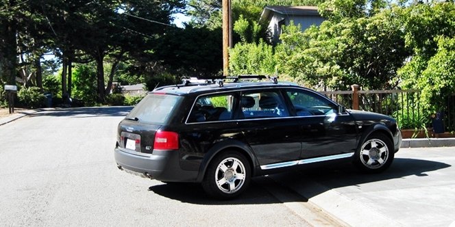 CLICK to continue: Black car pulling onto street