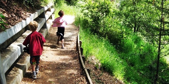 CLICK to continue: Sofia running down beach trail