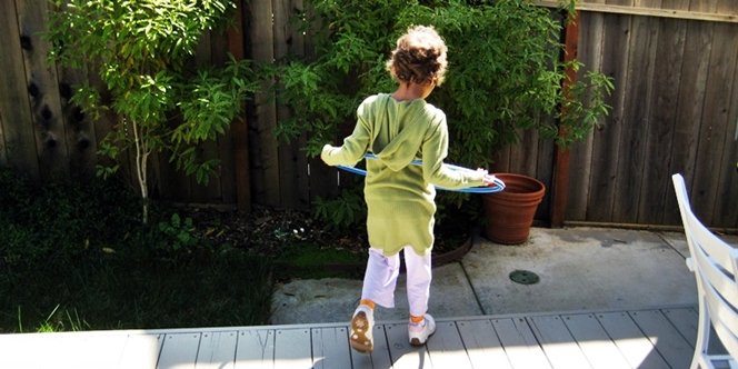 CLICK to continue: Sofia on the back deck with hula hoop