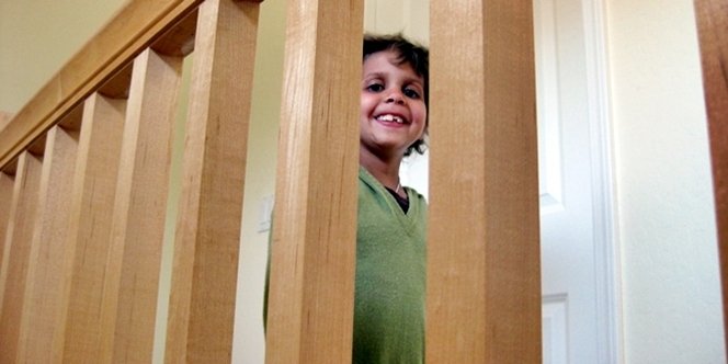 CLICK to continue: Sofia peeking through banister rails