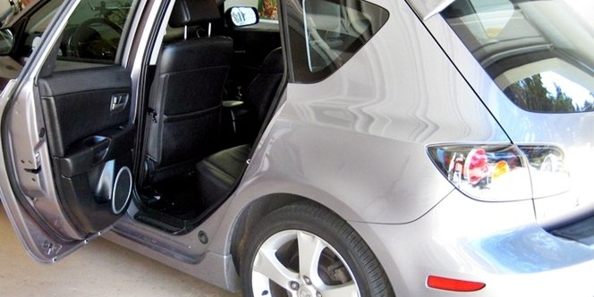 CLICK to continue: grey car with back door open