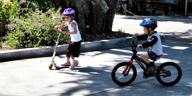 CLICK to continue: Scooter vs bike races on the driveway