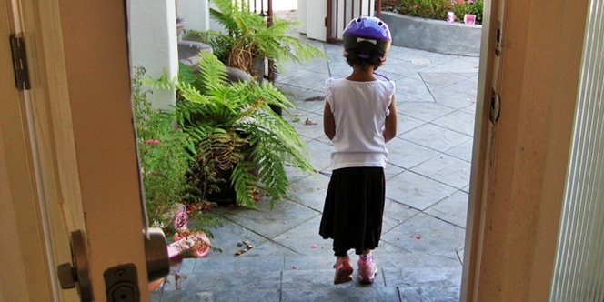 CLICK to continue: Sofia on the front step wearing a helmet